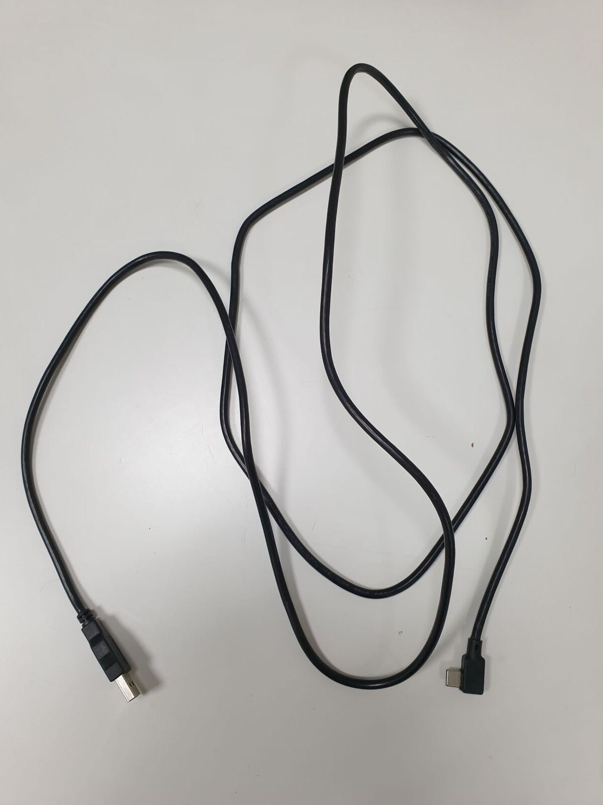 Hema 2 m charger lead laid out, with USB-A plug and right-angle USB-C plug