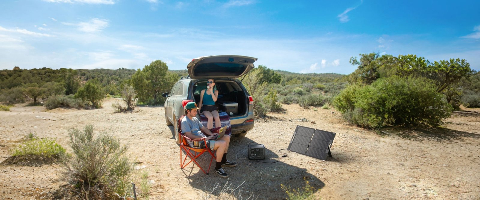BLUETTI 100W solar panel set up at a desert road-trip camp